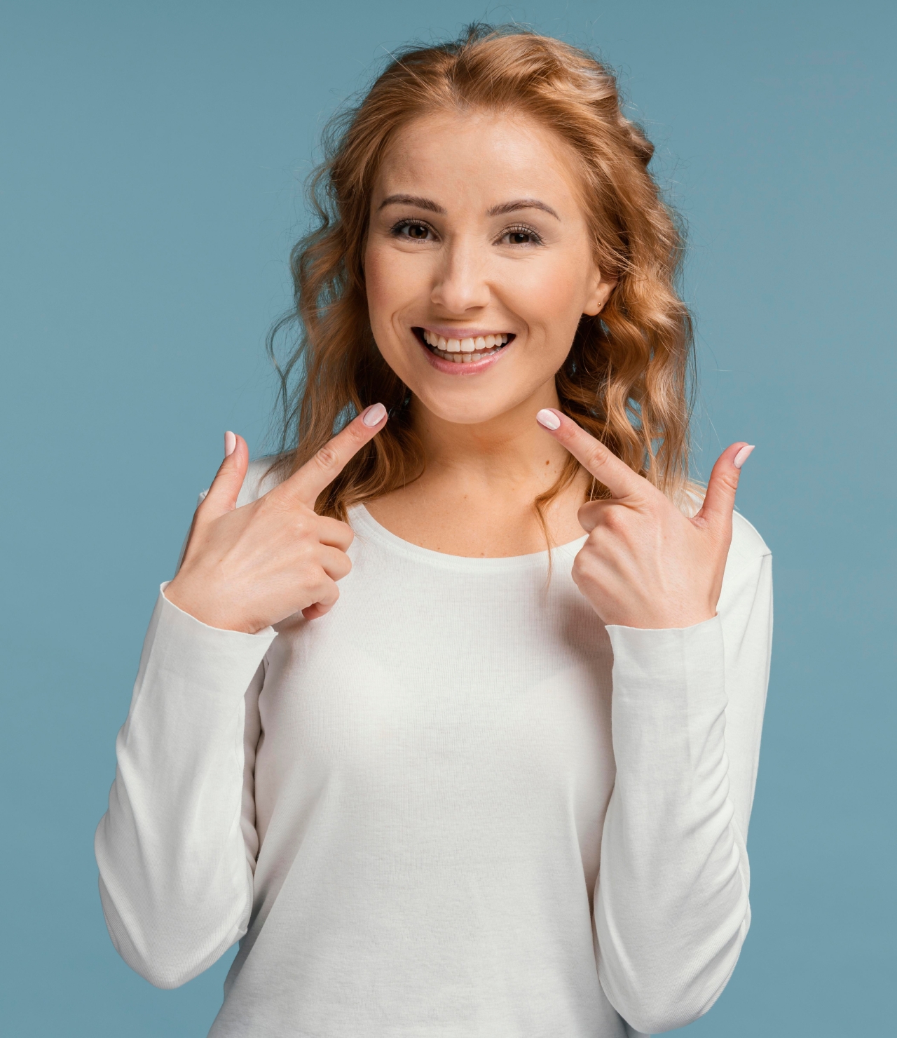 woman holding sign up smiling